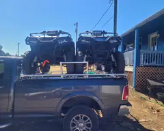 Two ATVs on a custom aluminum rack over a pickup bed