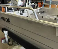 Aluminum boat with custom grab rails Neal welded along the sides