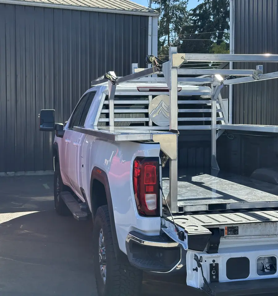 Aluminum ladder rack with a customer's company logo cut into the headache rack