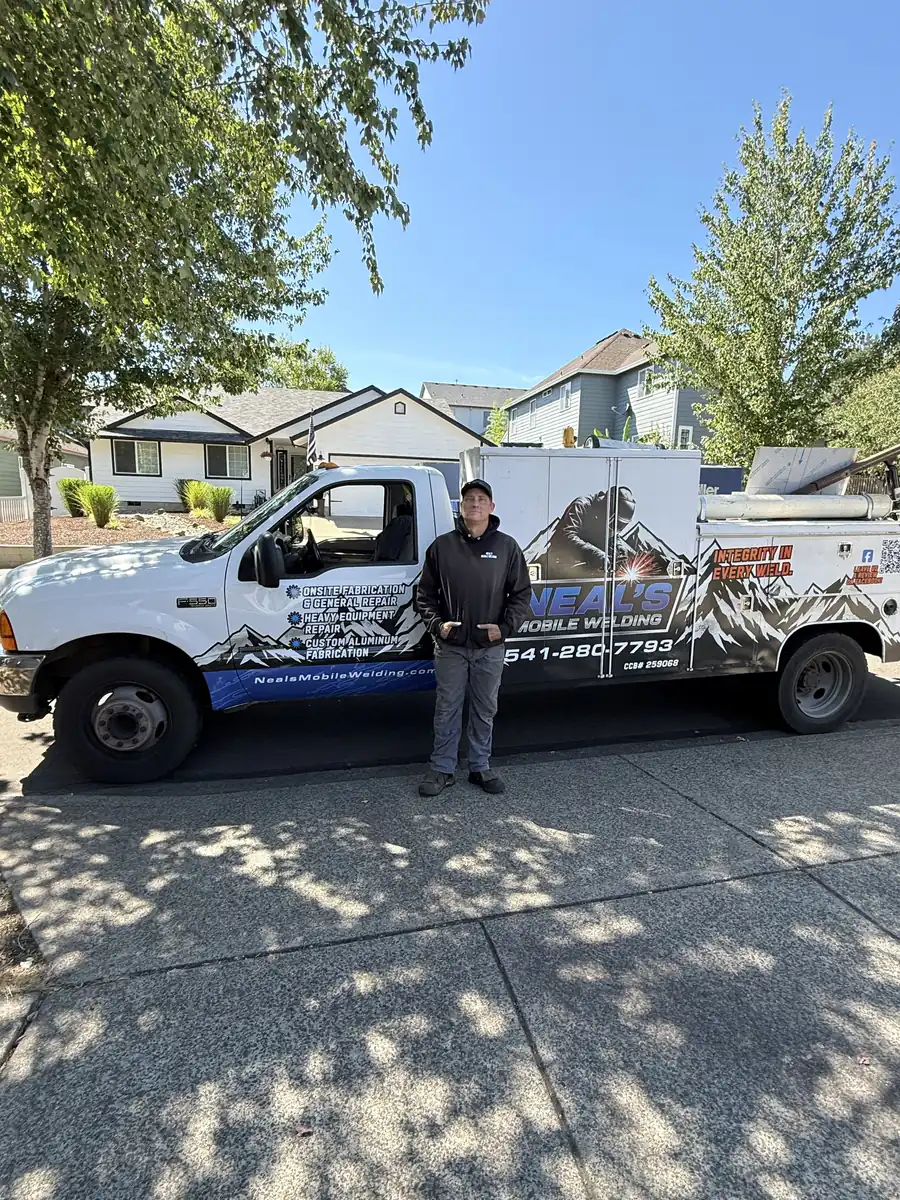 Neal standing next to his welding truck