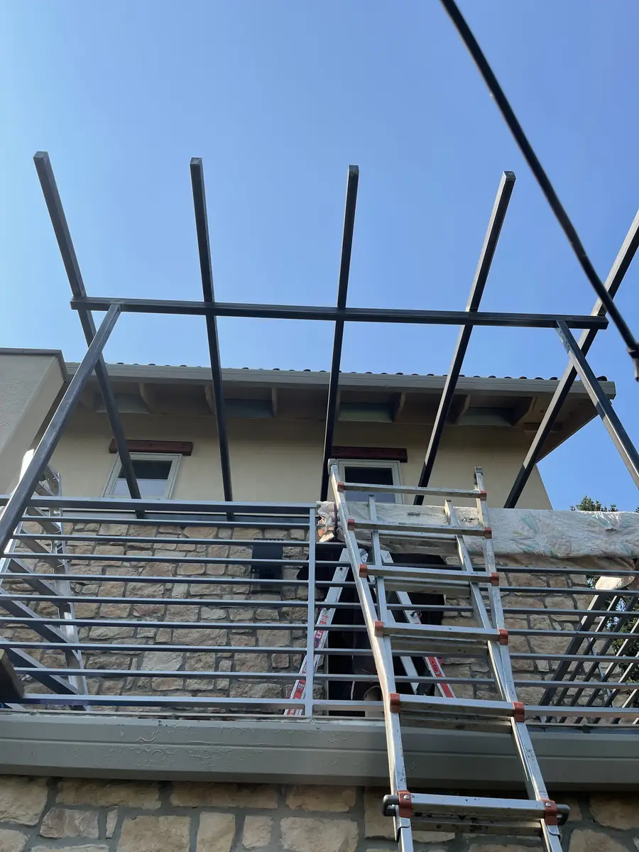Trellis frame Neal welded together up on a second-story deck
